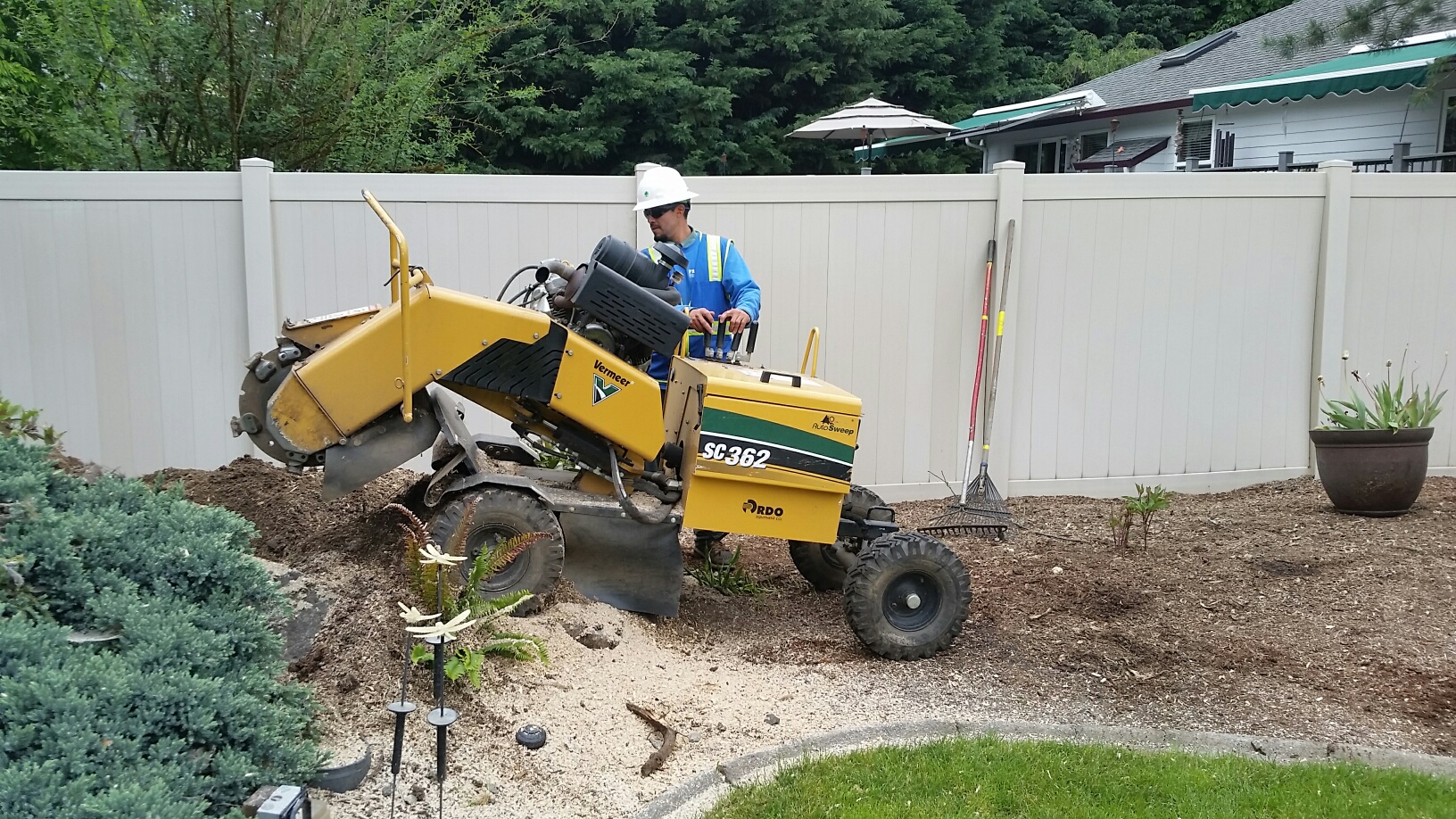 Image of machinery performing stump grinding services.